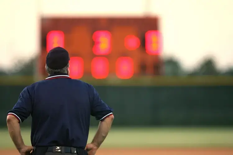 Man looking at scoreboard