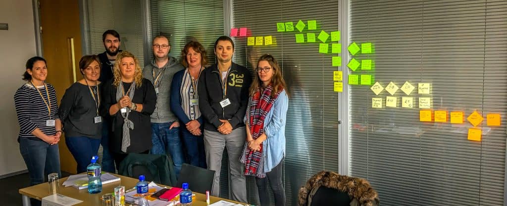 Group of professionals participating in a Lean training session in Ireland.