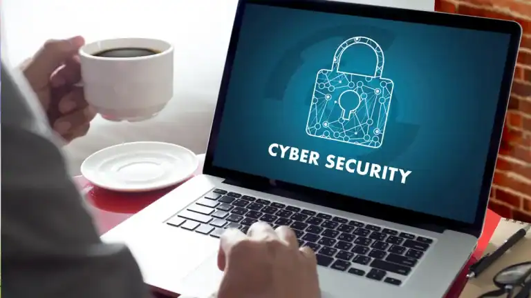 Laptop screen displaying cyber security lock icon and text.