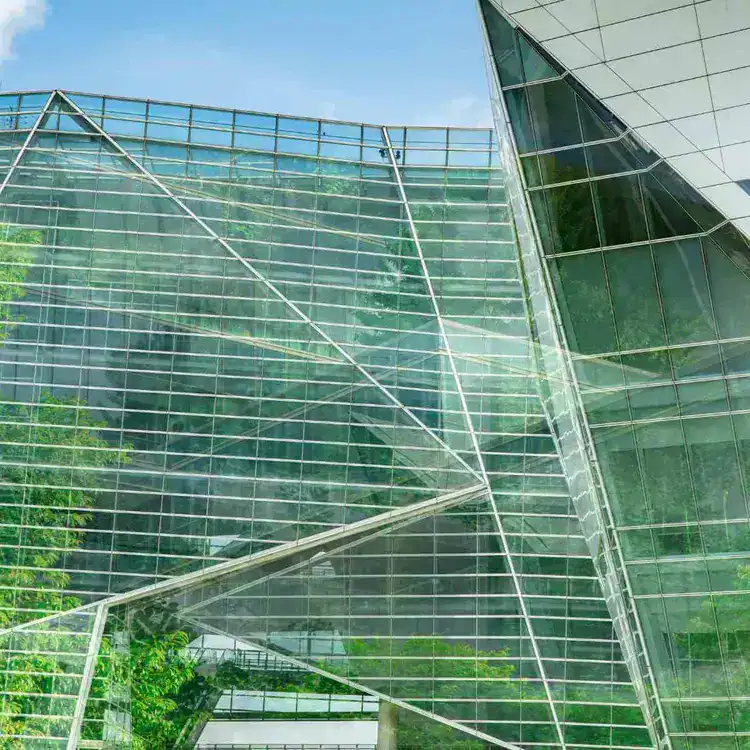 Sleek contemporary architecture with extensive glass panels and sharp angles.