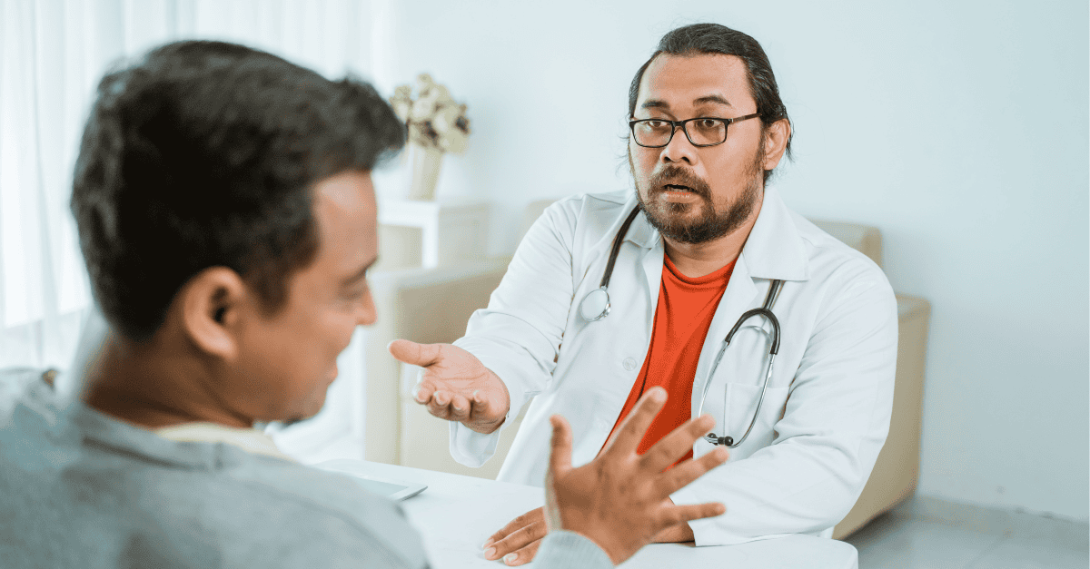 Doctor explaining health issues to a patient during a consultation.