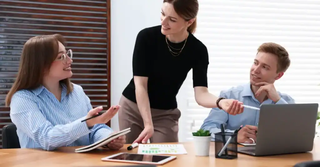 An engaging team discussion on lean practices in a modern office setting.