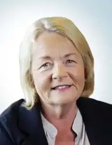 Professional woman in business attire smiling for the camera.
